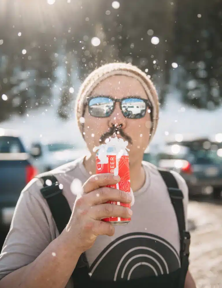 skier drinking uberbrew groovis outside